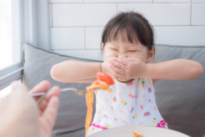 young girl with ARFID food refusal